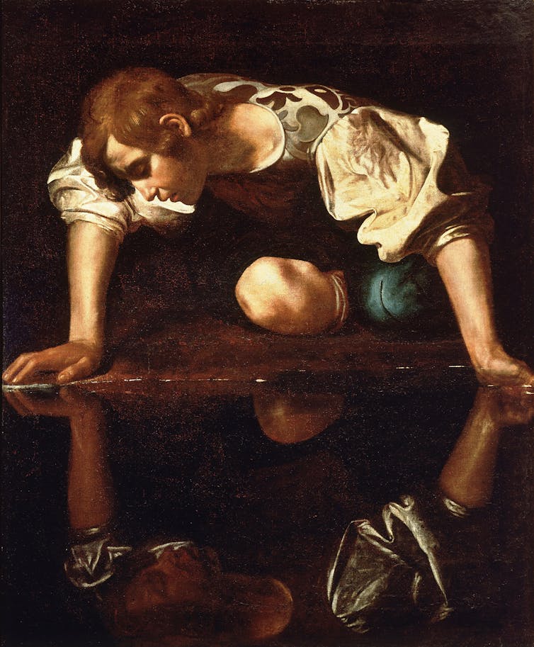Narcissus kneels before a pool.