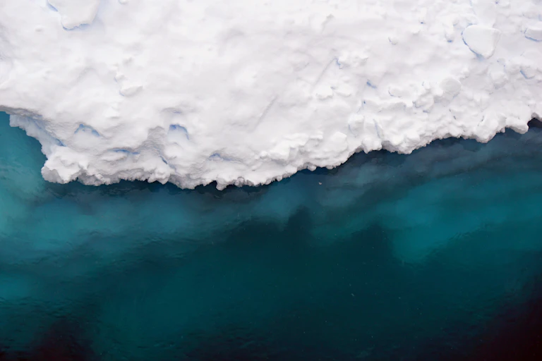 iceberg and cold blue sea