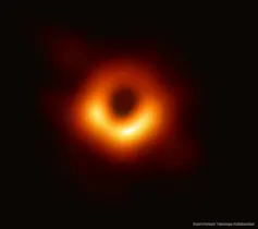 A red and orange donut shape on a black background