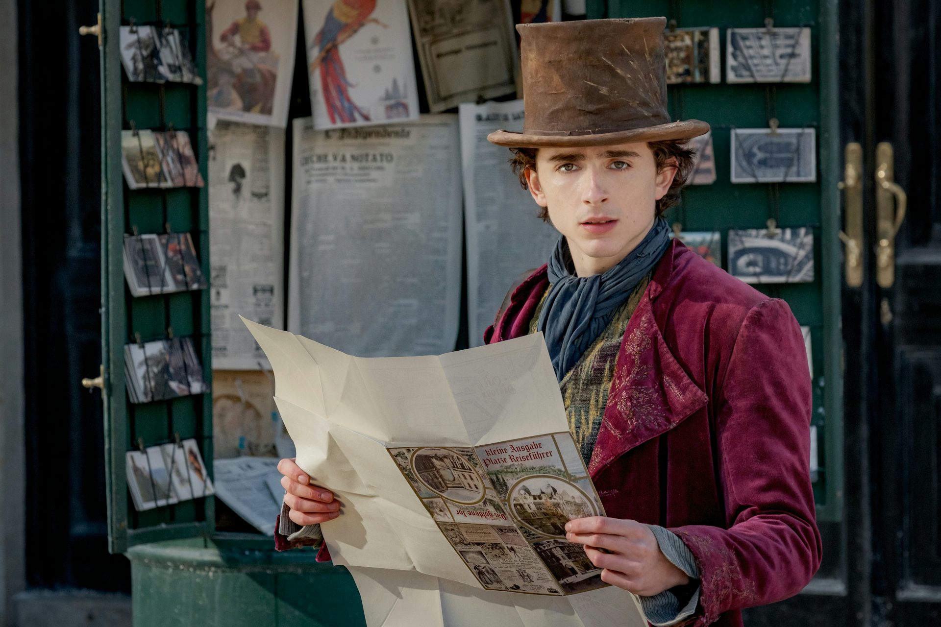Chalamet as Wonka reading a paper.