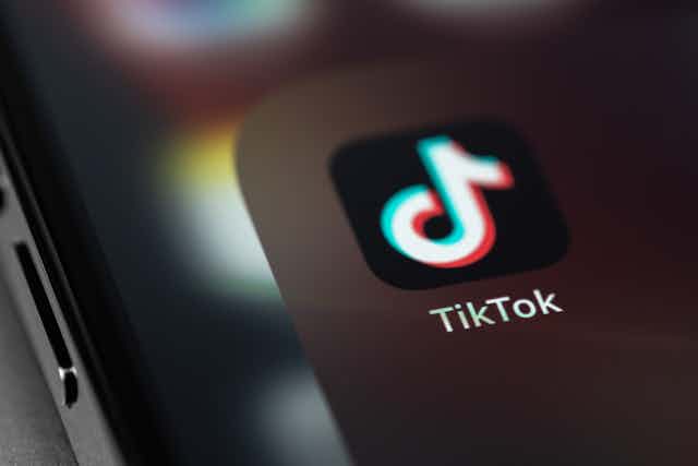 TikTok logo on a mobile phone.