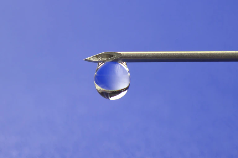 Liquid drop on the end of a needle