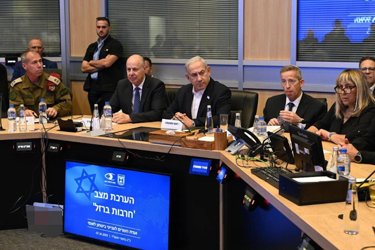 A group of people sit at a table.