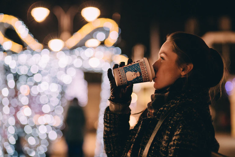 Woman drinking festive coffee