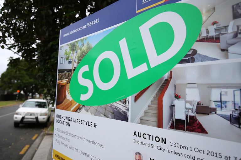 for sale sign with sold sticker