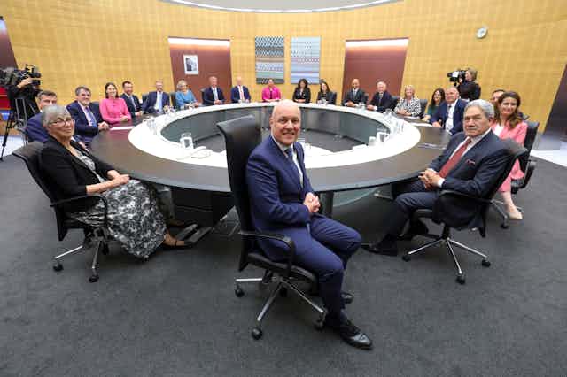 Cabinet table at parliament with Christopher Luxon in foreground