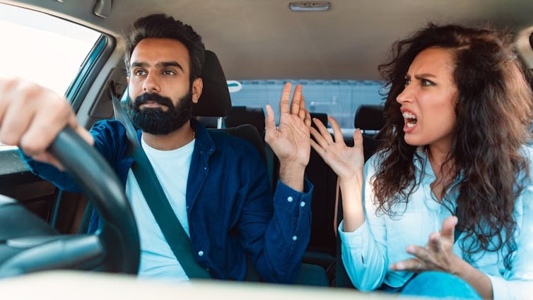 Couple arguing while driving