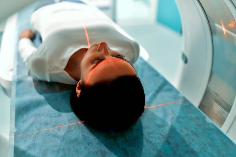 woman lies down for MRI scan