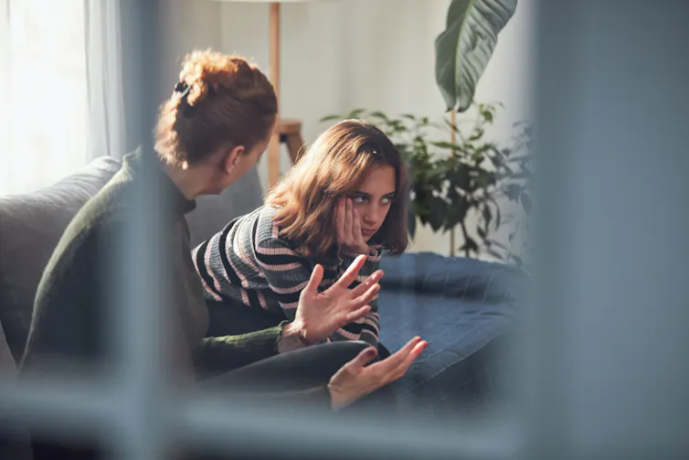 Mother talks to teen.