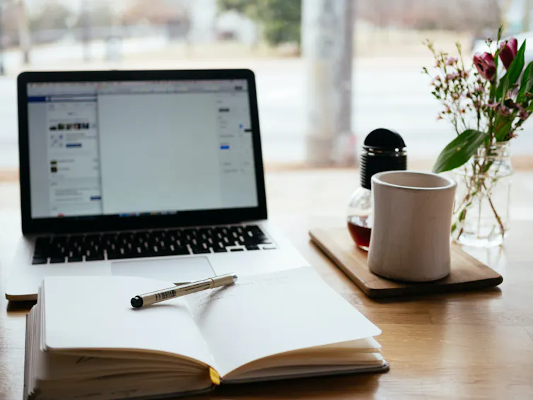 A computer and notebook.
