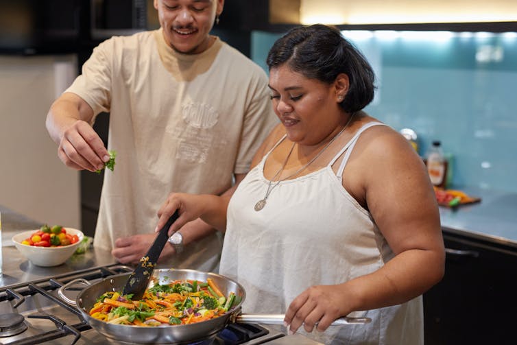 Couple cook together