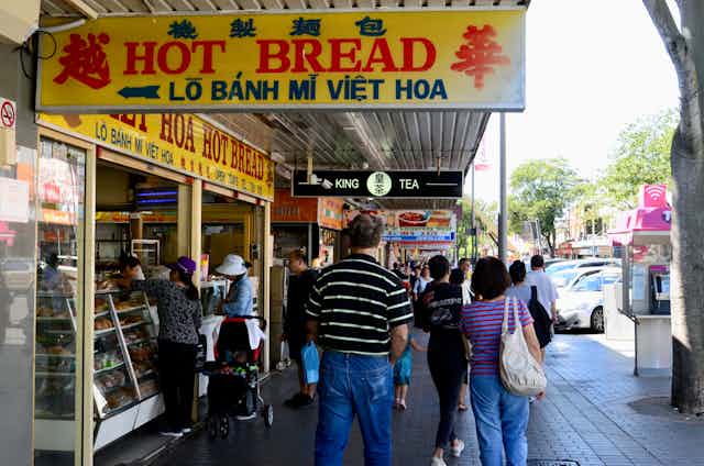 A shopping street in Cabramatta with English and Asian language signs