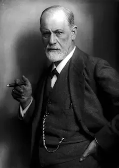 Bearded man holding a cigar