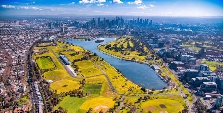 Aerial view of lake in front of skycrapers in Melbourne CBD