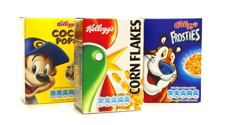Row of cereal boxes with nutrition labels.