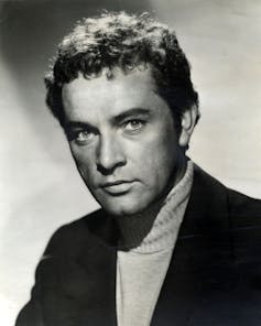 A young man in the 1950s with a very direct engaging expression.