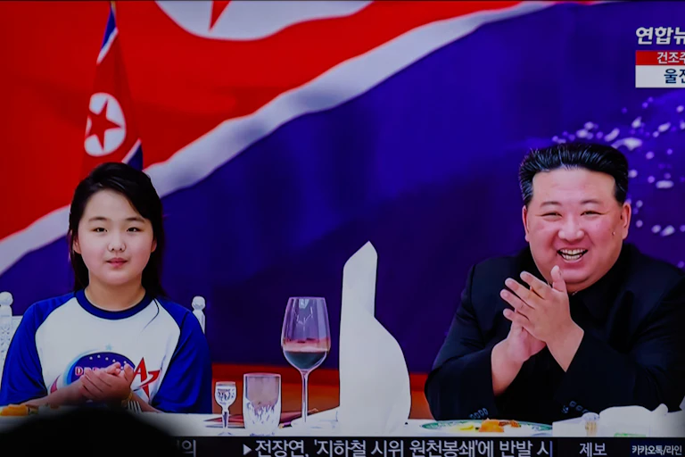 Kim Jong-un and his daughter Kim Ju-ae at a banquet, NOvember 2023.