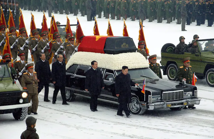 Kim Jong-un and his uncle Jang Song-thaek walk beside a hearse at the funeral of Kim Jong-il in Pyongyang, December 2011.