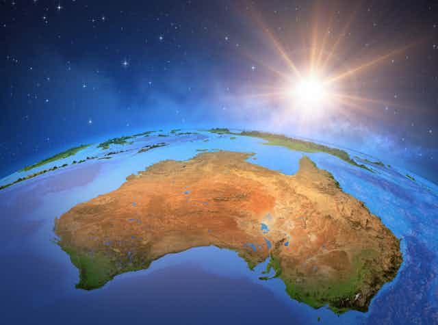 Surface of the Planet Earth viewed from a satellite, focused on Australia, sun rising on the horizon. 3D illustration - Elements of this image furnished by NASA.