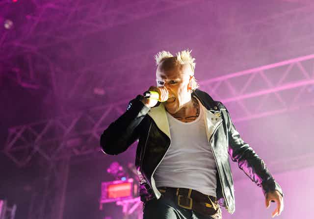 The lead singer of The Prodigy singing.