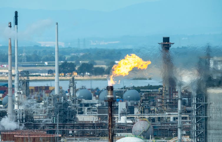 A gas flare at an oil refinery.