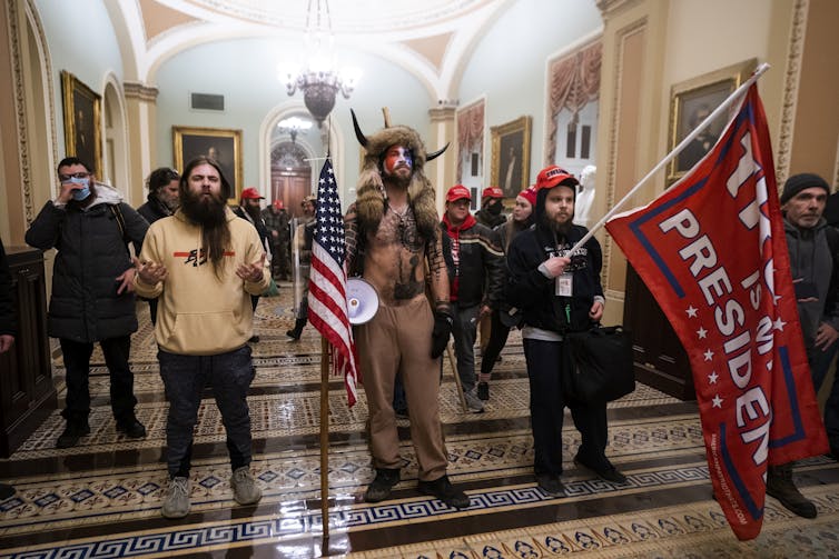 Rioters pictured in the US Capitol during the January 6 atttack.