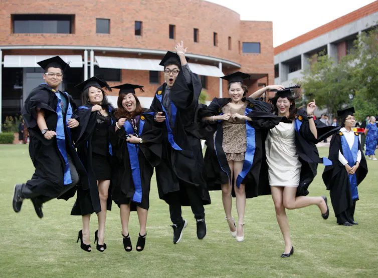 International students celebrating their graduation