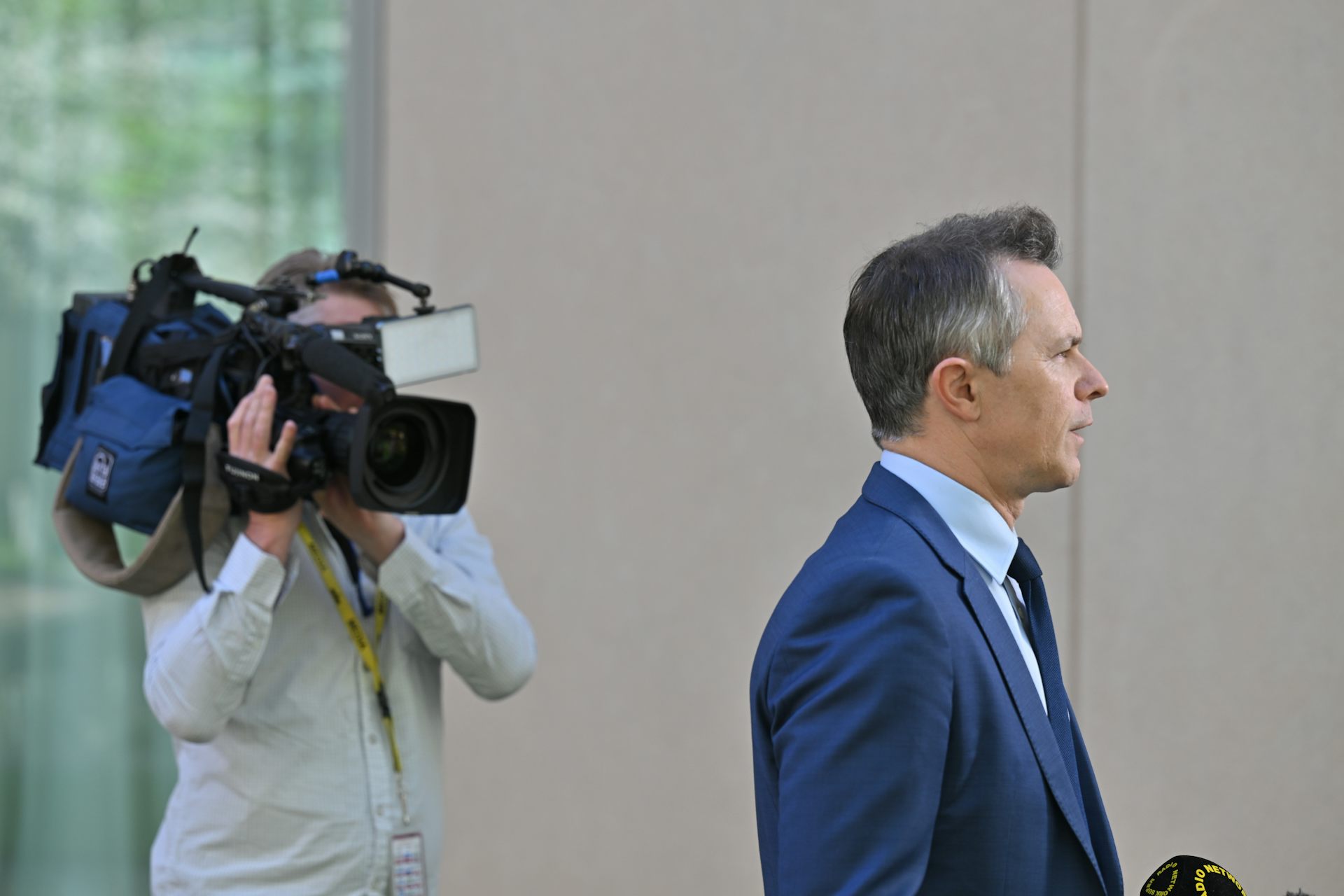 Education Minister Jason Clare speaks at a press conference in the grounds of Parliament House.