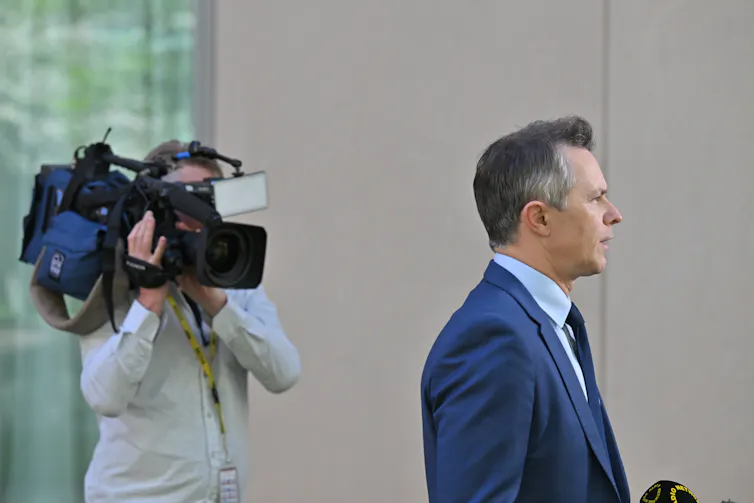 Education Minister Jason Clare speaks at a press conference in the grounds of Parliament House.