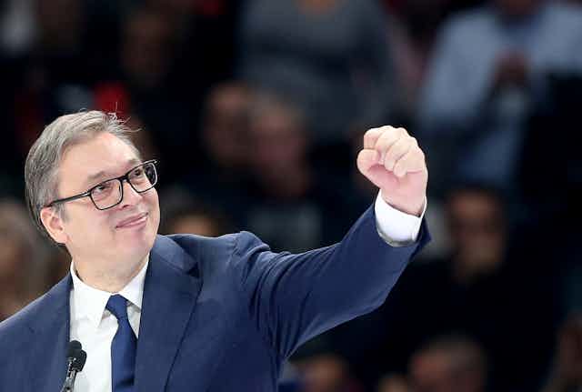 Serbian President Aleksandar Vucic gestures to supporters during the Serbian Progressive Party rally in Belgrade, December 2023.