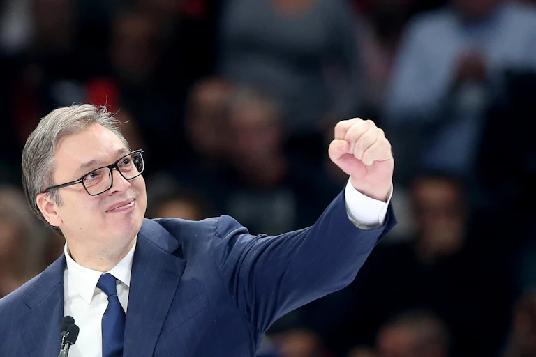 Serbian President Aleksandar Vucic gestures to supporters during the Serbian Progressive Party rally in Belgrade, December 2023.
