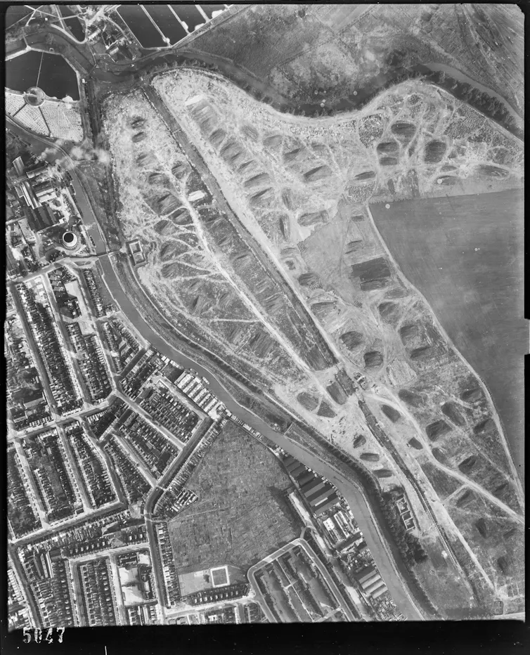 An aerial black and white photograph of an urban landscape.