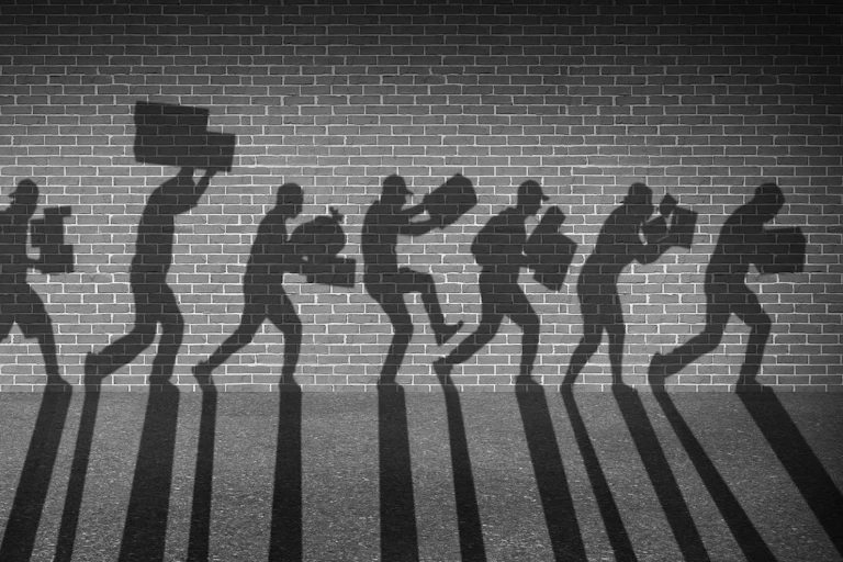 An illustration of shadows against a wall, running with boxes and bags in their arms as if stealing.