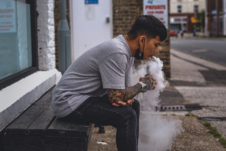Man vapes