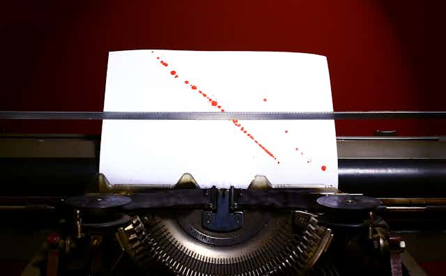 Bloodstained paper in a typewriter