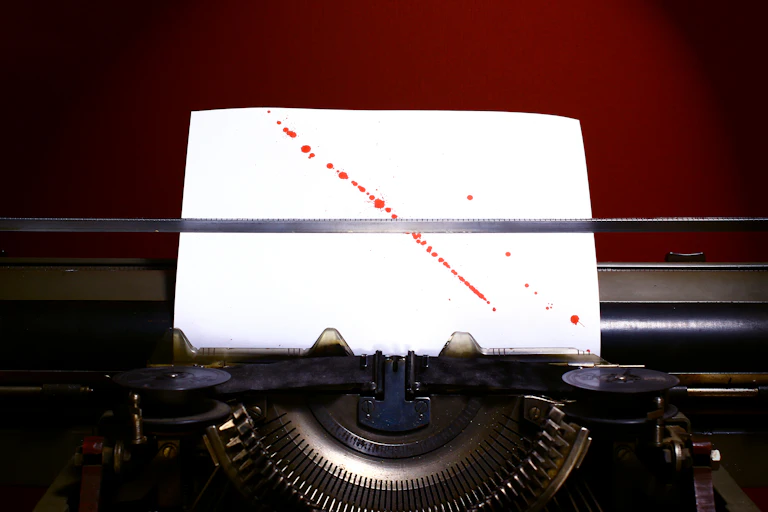Bloodstained paper in a typewriter