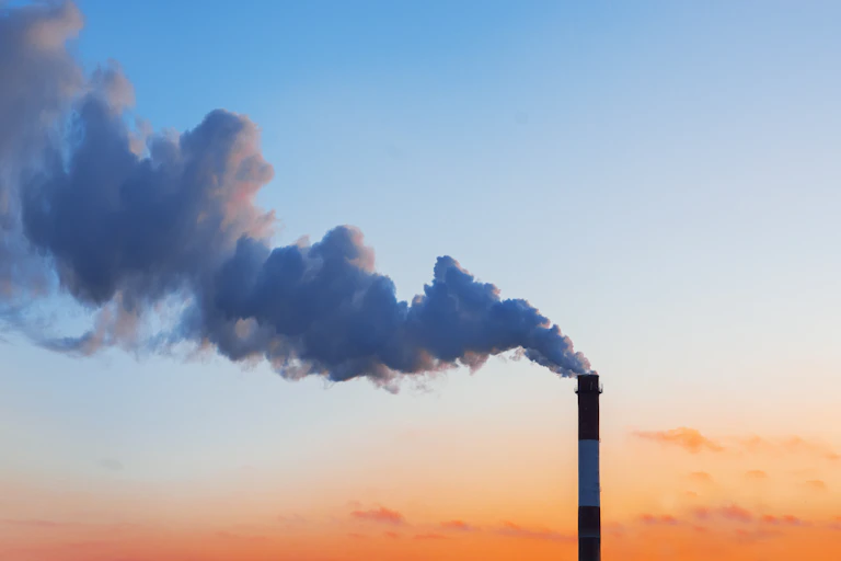 smokestack and smoke in the sky