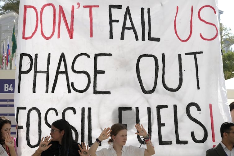 banner protesting fossil fuel use