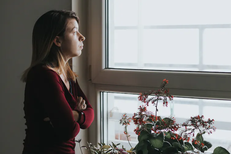 Woman staring out a window