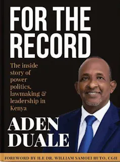 A book cover with a photo of a smiling African man in a suit and tie.