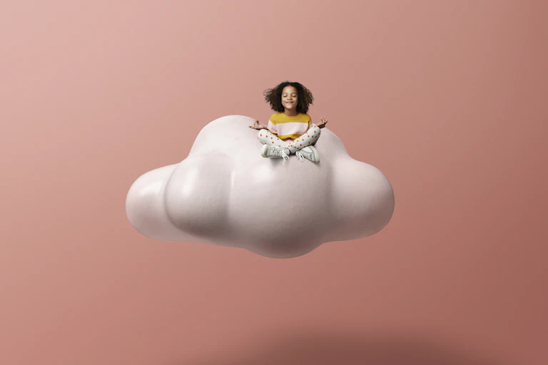 Child sitting on cloud meditating