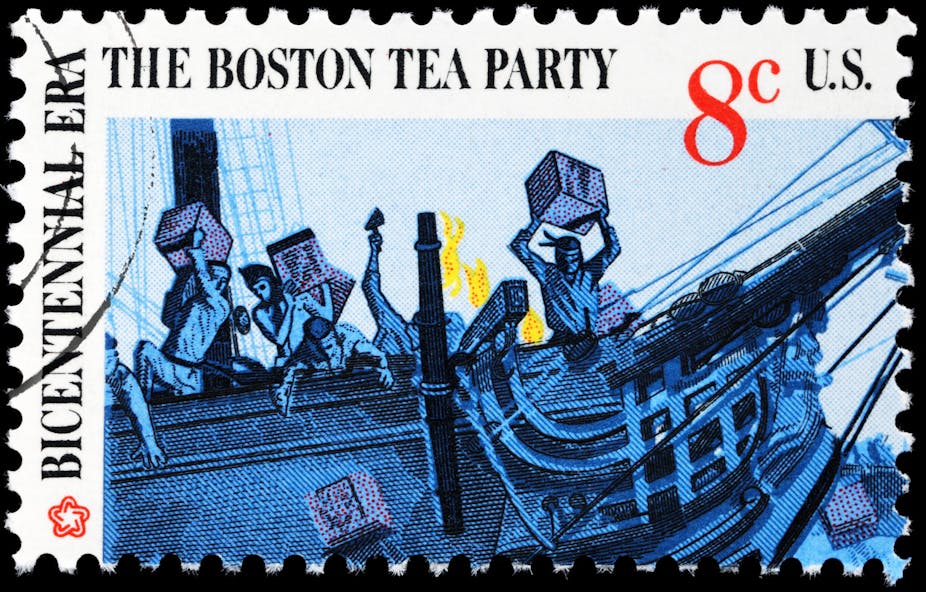 A canceled 1973 postage stamp depicts protesters hurling boxes of tea from a ship into Boston Harbor.