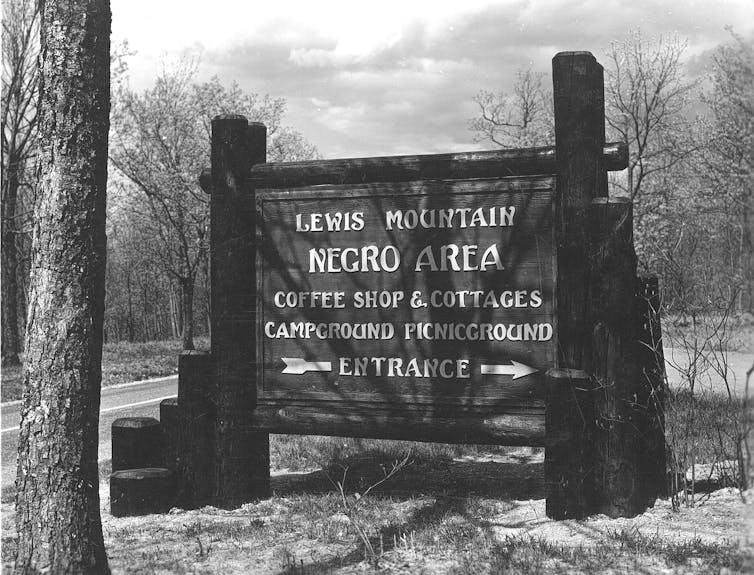 A sign posted near a road tells visitors where the Negro area is at the park.