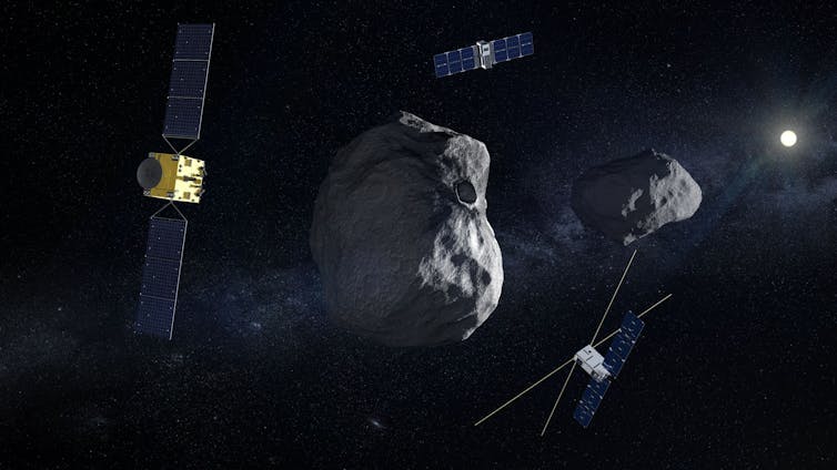 An illustration of two gray asteroids, next to a gold box with two large rectangular panels on either side, and two smaller crafts.