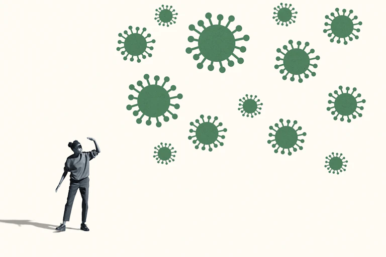 Person shielding face from a swarm of viruses