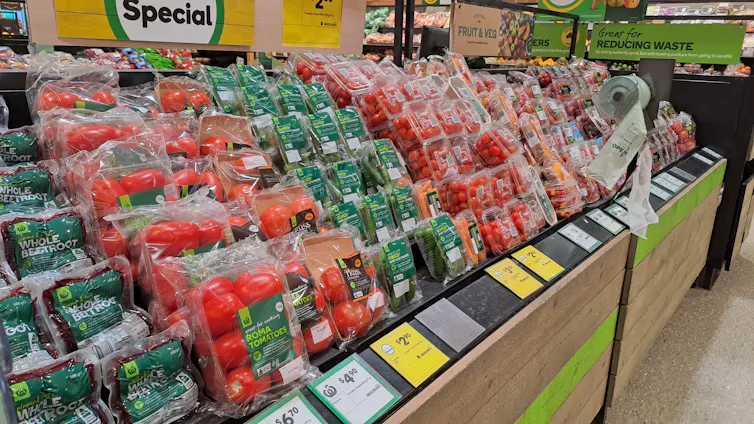 Prices are displayed on fruit and veg at a supermarket.