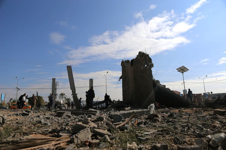 An area with damaged buildings and rubble after an attack by Israeli forces on Gaza.