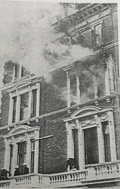 Smoke coming out of the window of a large London apartment