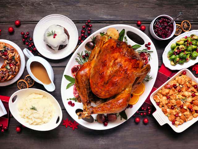 A holiday dinner with turkey, stuffing, potatoes, vegetables etc