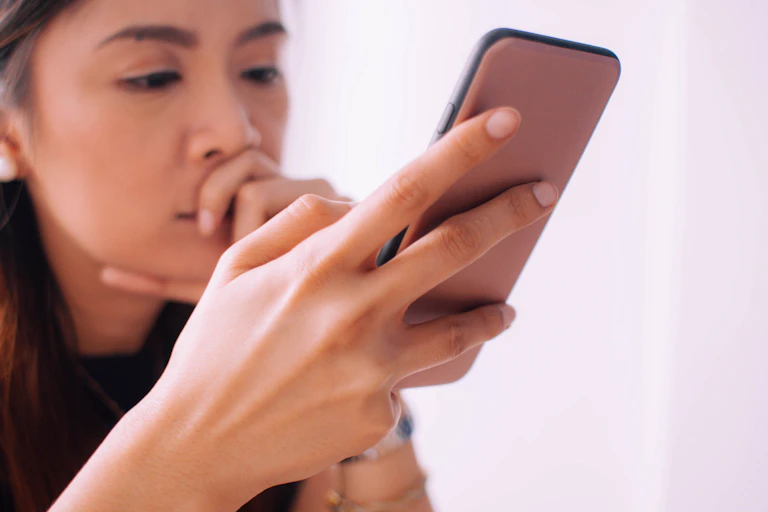 An Asian woman using a smartphone